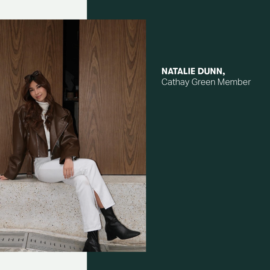 Natalie Dunn seated indoors and smiling.